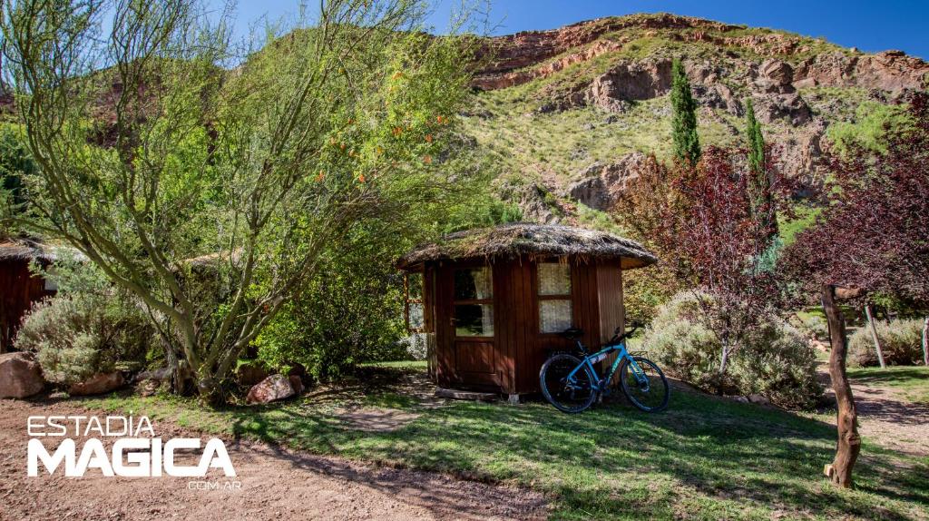 a bike parked in front of a small cabin at Glamping en Valle Grande in Valle Grande
