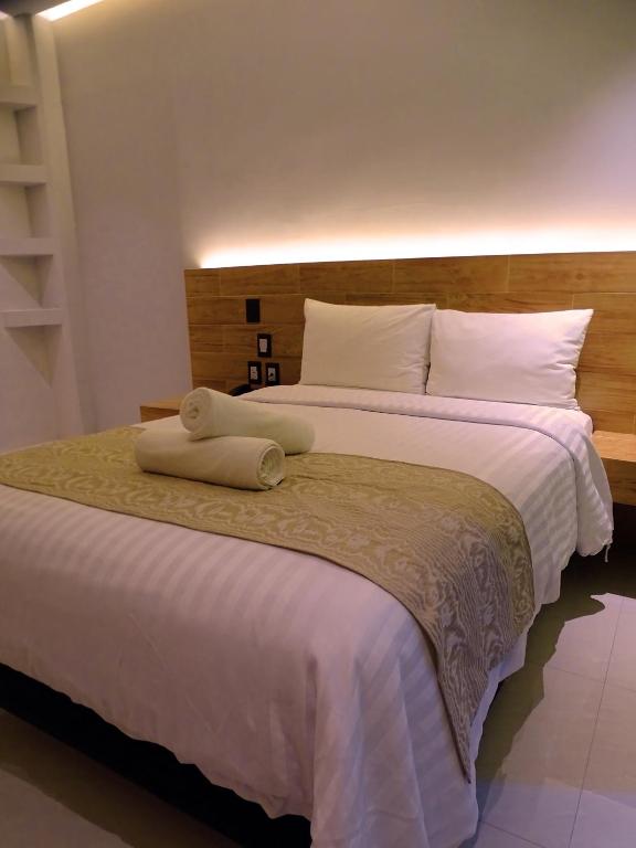 Postel nebo postele na pokoji v ubytování Hotel Kavia Plus