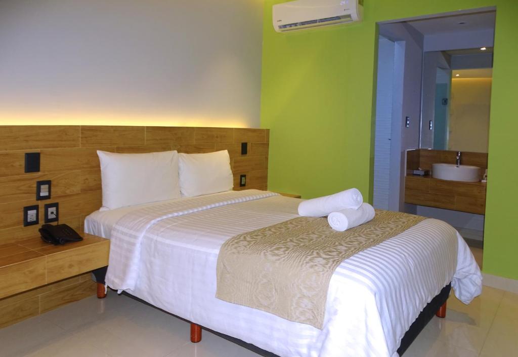 Postel nebo postele na pokoji v ubytování Hotel Kavia Plus