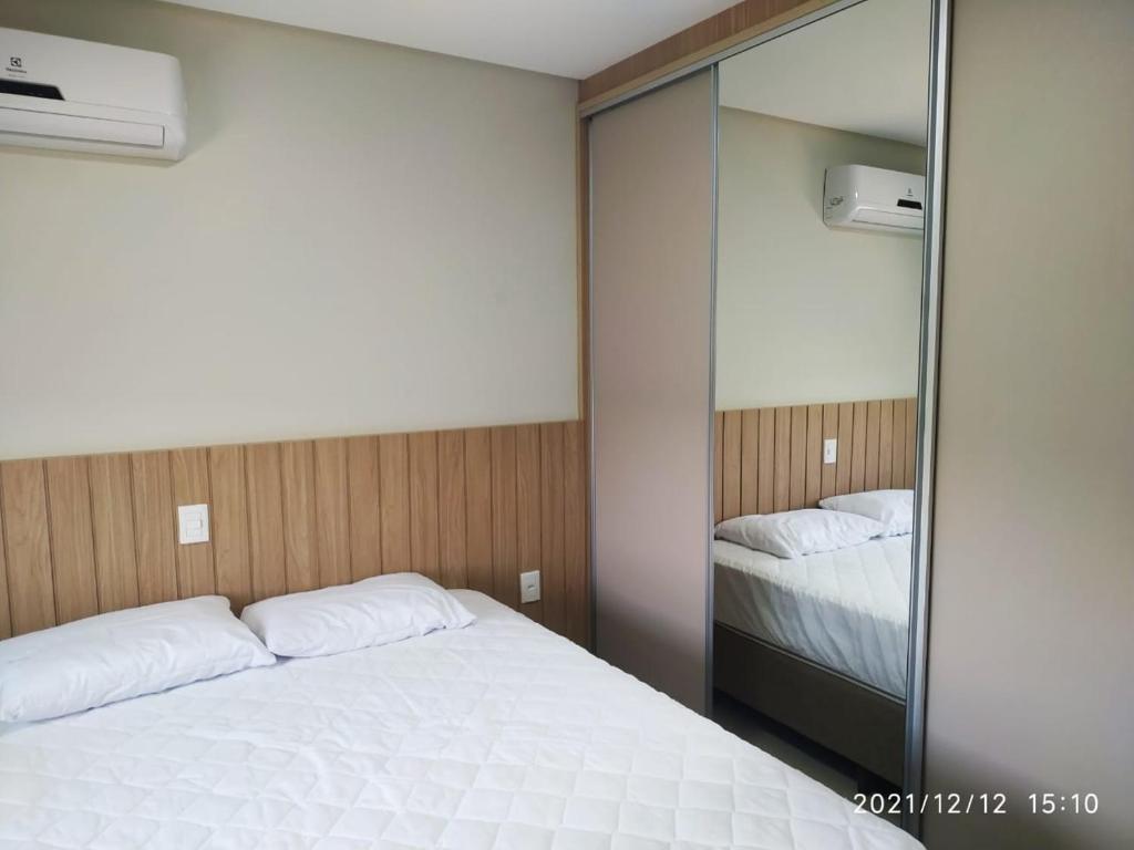 En eller flere senge i et værelse på Melhor vista e localização nas Termas