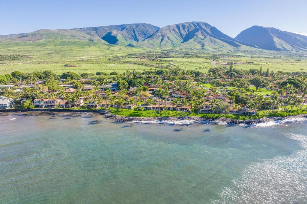 an aerial view of a beach with mountains in the background at Puamana 30-2 in Lahaina