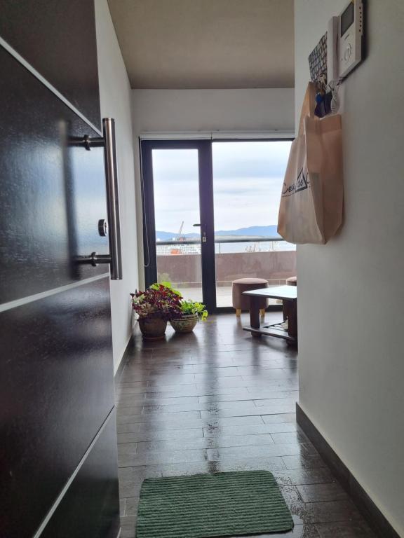 a hallway with a room with a view of the ocean at Amaneciendo frente al Beagle in Ushuaia