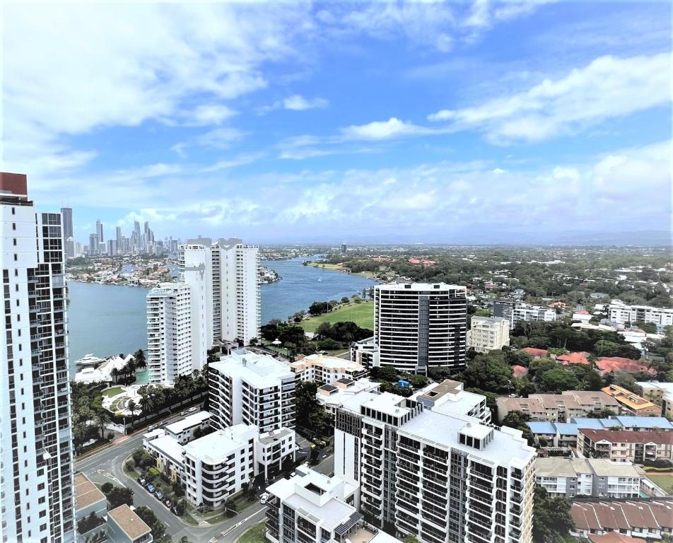 an aerial view of a city with a river and buildings at Brighton Shores in Gold Coast