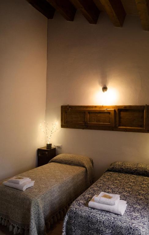 Postel nebo postele na pokoji v ubytování Dimora Barbolani