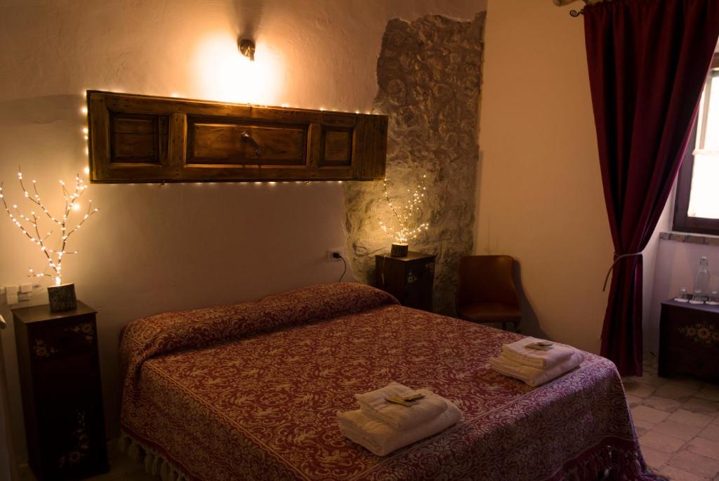 Postel nebo postele na pokoji v ubytování Dimora Barbolani