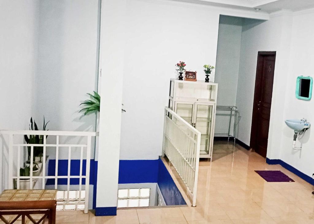 Postel nebo postele na pokoji v ubytování Homestay Dieng Persada Syariah Mitra RedDoorz
