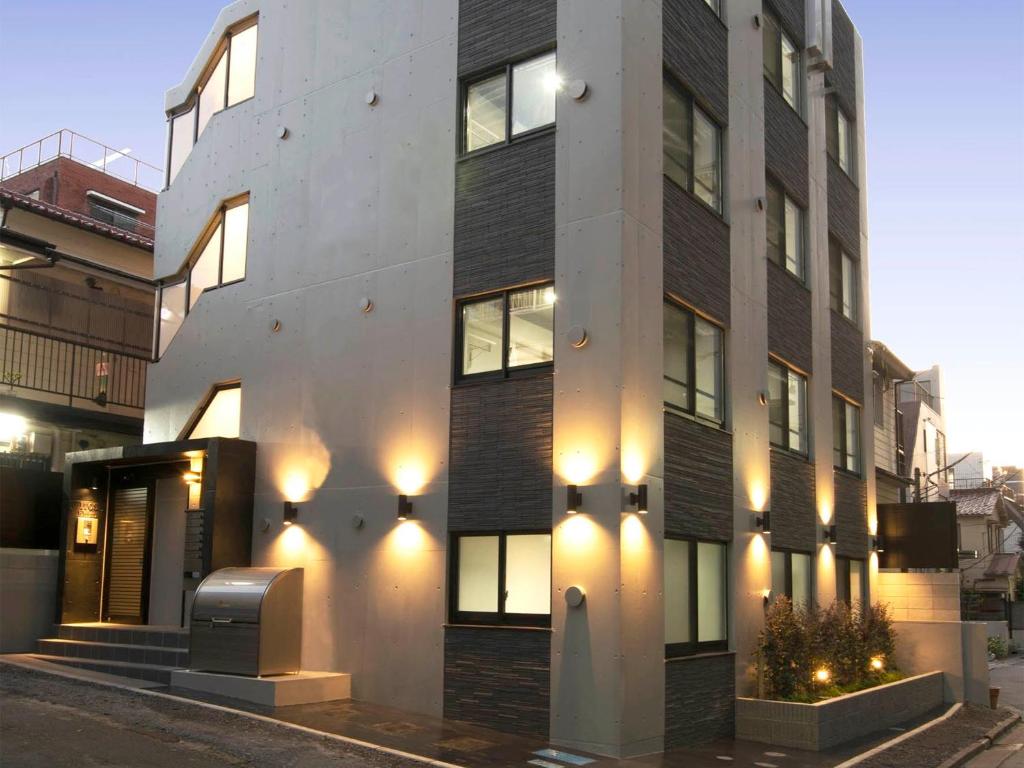 a building with lights on the side of it at Itos Ebisu in Tokyo