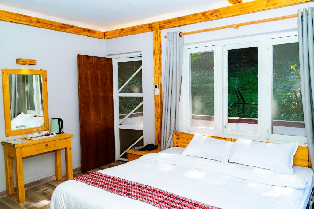 Postel nebo postele na pokoji v ubytování Silu Homes by Hostmandu