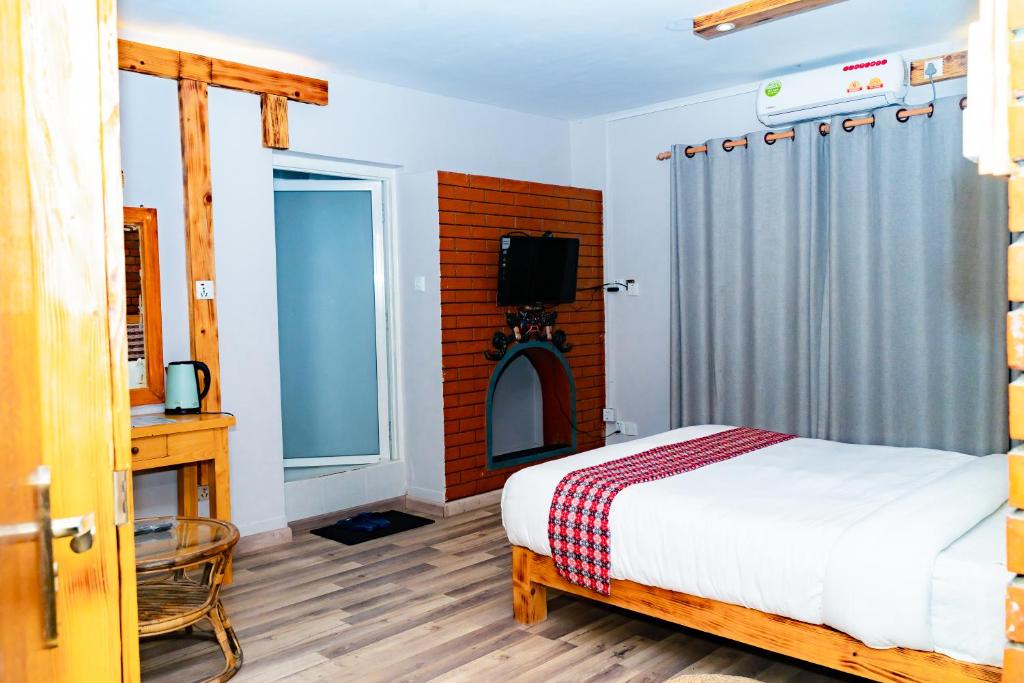 Postel nebo postele na pokoji v ubytování Silu Homes by Hostmandu