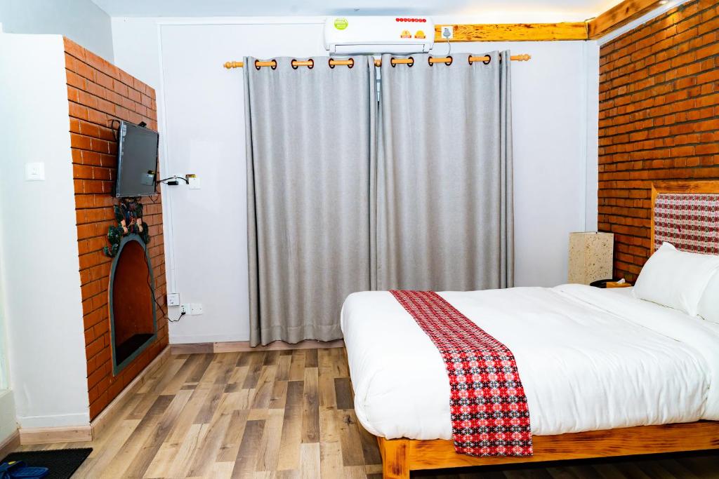 Postel nebo postele na pokoji v ubytování Silu Homes by Hostmandu