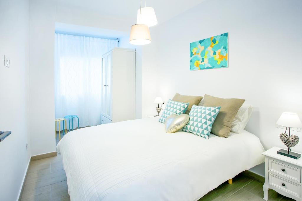 A bed or beds in a room at Alonso de Palencia City Center Apartment