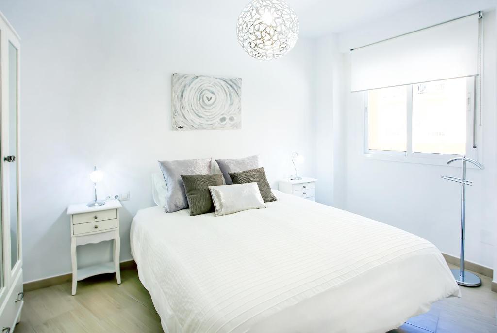 A bed or beds in a room at Alonso de Palencia City Center Apartment