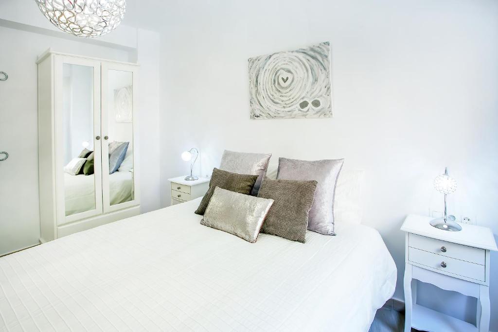 A bed or beds in a room at Alonso de Palencia City Center Apartment