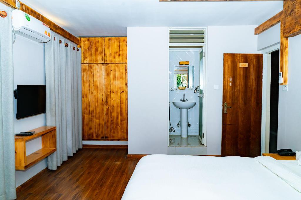 Postel nebo postele na pokoji v ubytování Silu Homes by Hostmandu