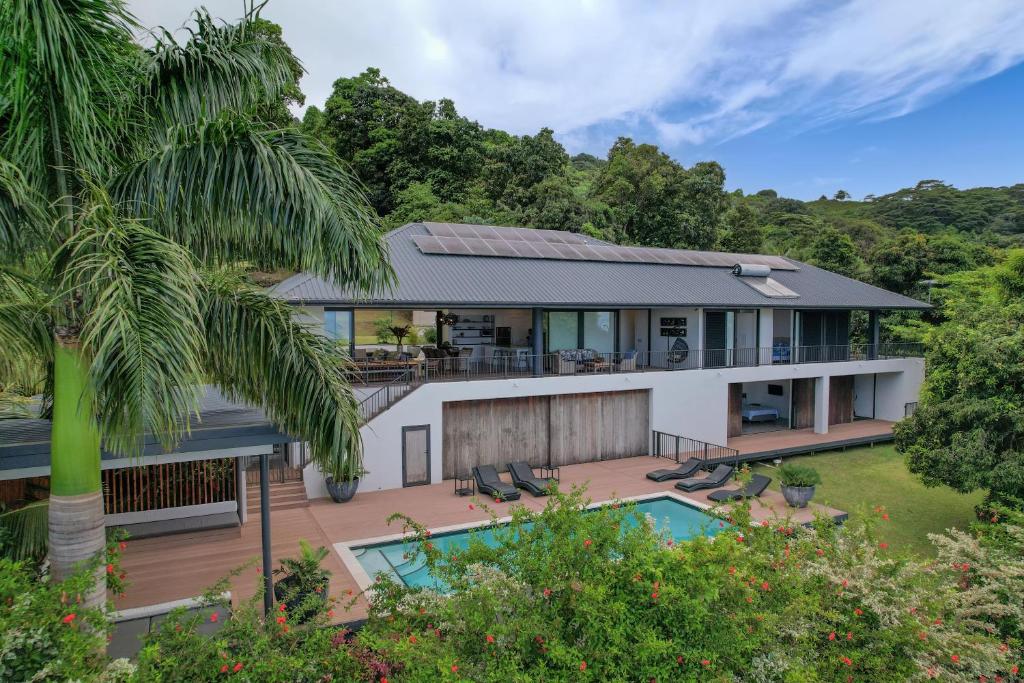an aerial view of a house with a swimming pool at Te Ravaki Estate in Rarotonga