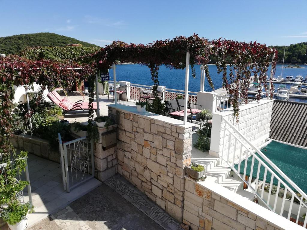 a patio with a view of the water at Shell Bay Apartments in Korčula