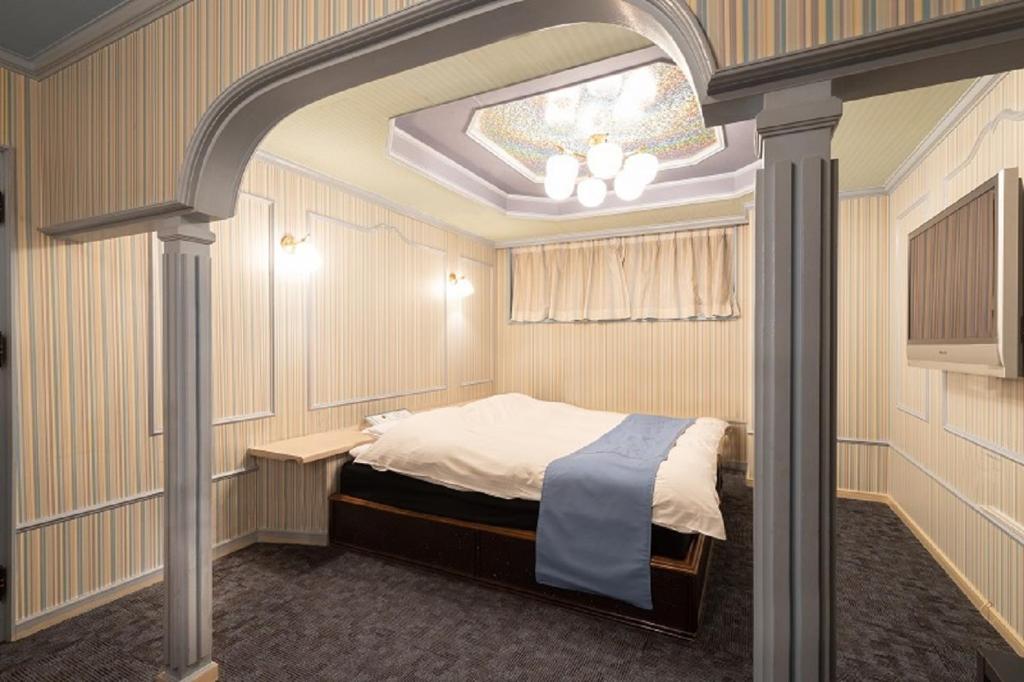 Postel nebo postele na pokoji v ubytování ホテル ドルフィンリゾート 岐阜 -大人専用-