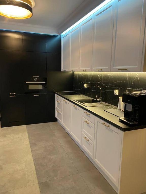 Kuchyňa alebo kuchynka v ubytovaní MALAGA APARTAMENTY BALTICUS