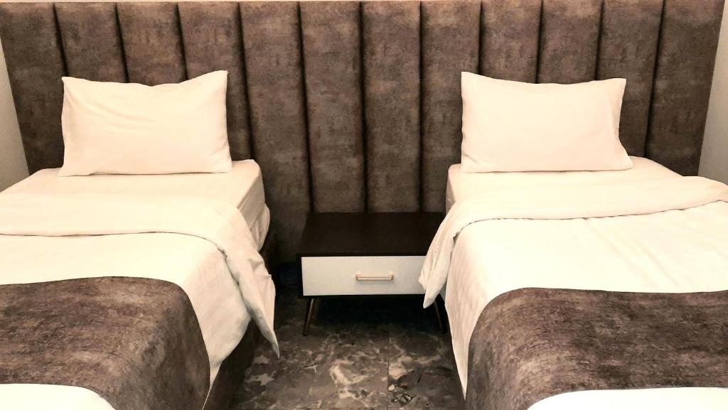Postel nebo postele na pokoji v ubytování جولدن نيو جوان - Golden New Gewan Hotel