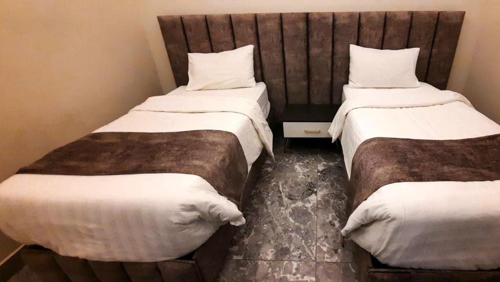 Postel nebo postele na pokoji v ubytování جولدن نيو جوان - Golden New Gewan Hotel