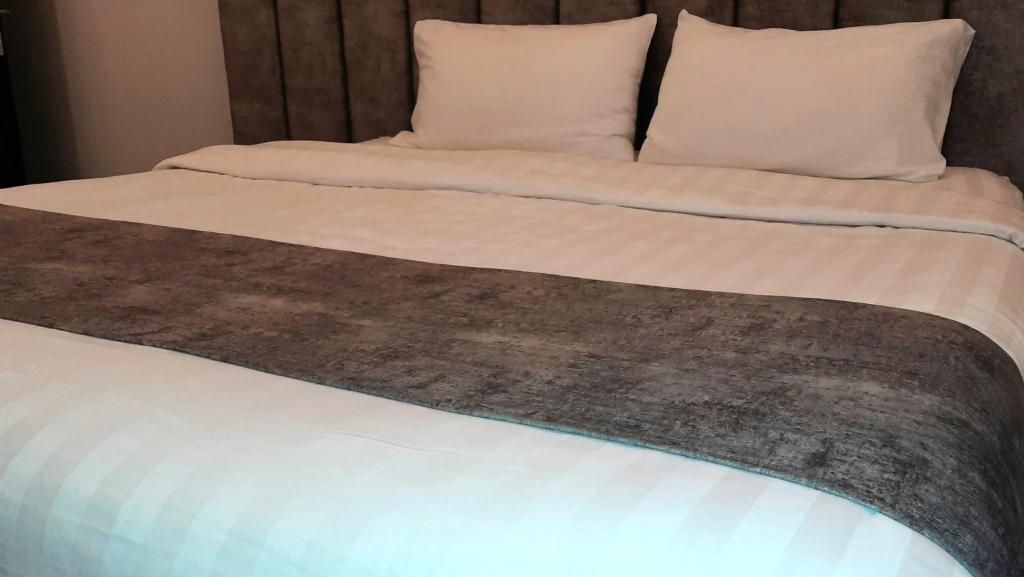 Postel nebo postele na pokoji v ubytování جولدن نيو جوان - Golden New Gewan Hotel