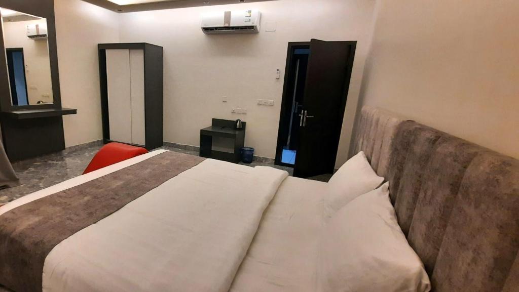 Postel nebo postele na pokoji v ubytování جولدن نيو جوان - Golden New Gewan Hotel
