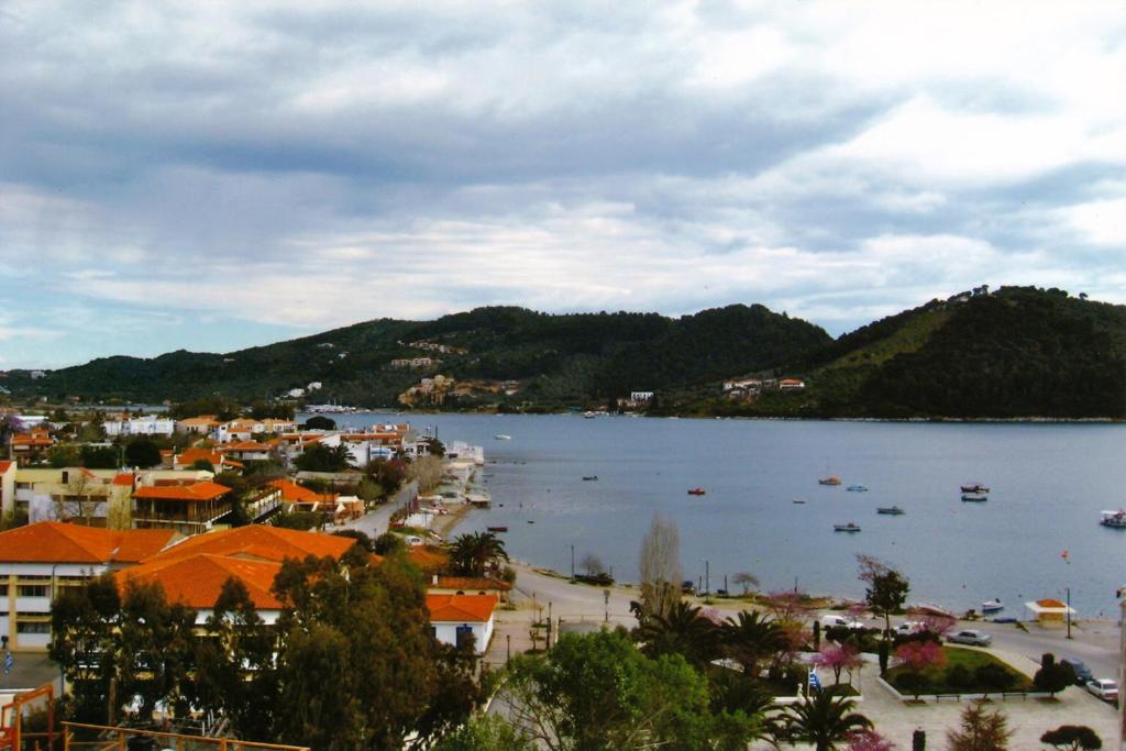 a view of a town and a body of water at Fresh Rooms in Skiathos