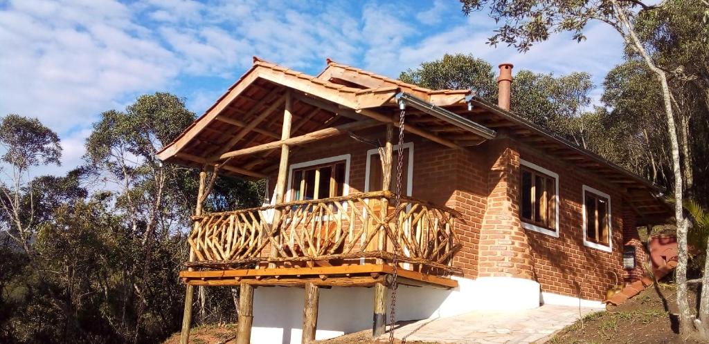 a house that is being constructed with a porch at Recanto do Leão in Alagoa