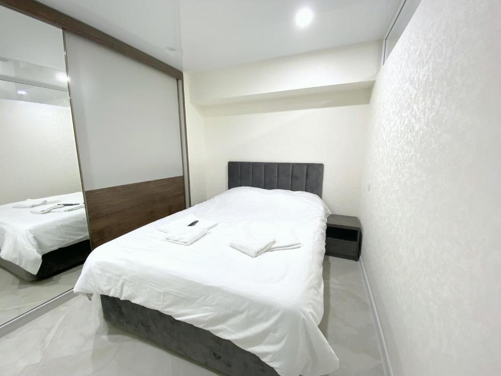 Postel nebo postele na pokoji v ubytování GSS Apartment