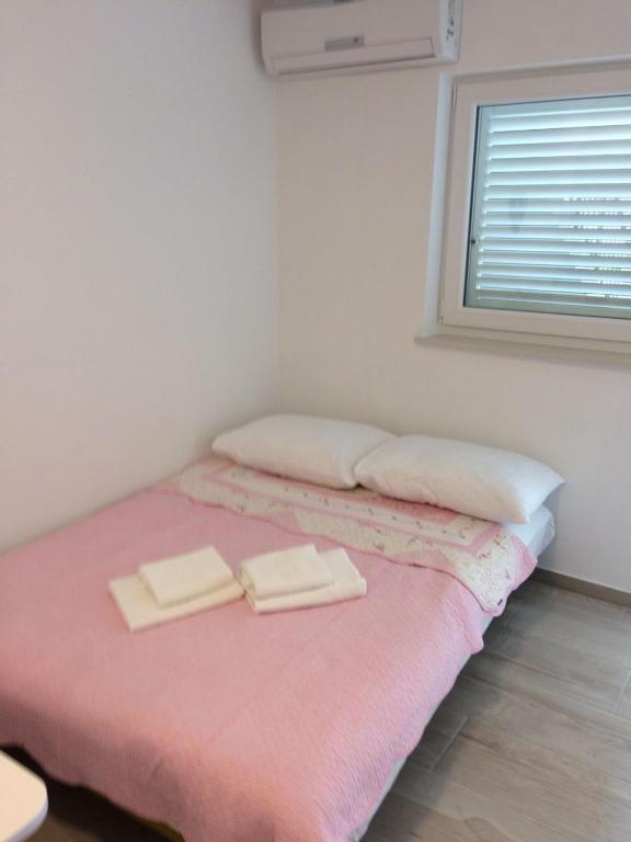Postel nebo postele na pokoji v ubytování Apartment in Podgora with sea view, terrace, air conditioning, WiFi 4492-1