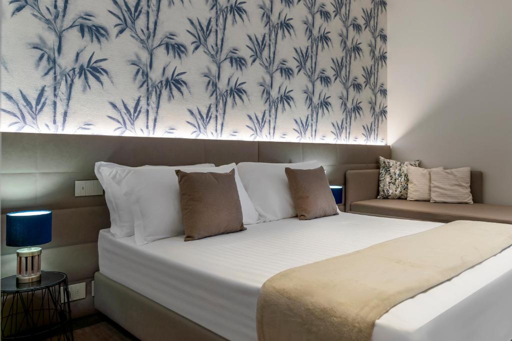 Postel nebo postele na pokoji v ubytování Civico25 Suite Hotel