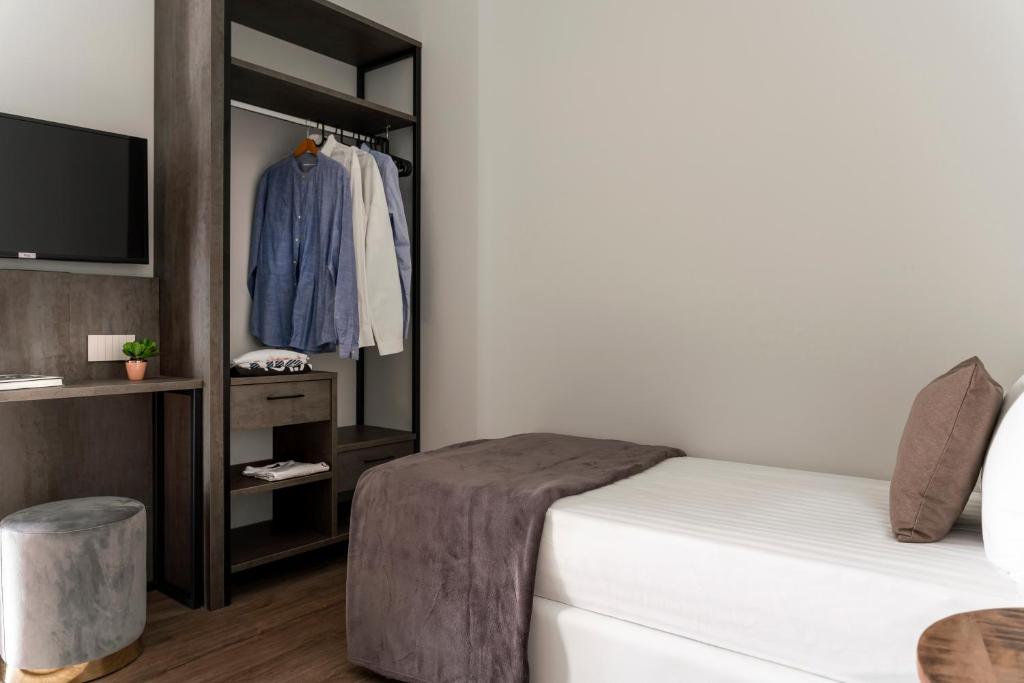 Postel nebo postele na pokoji v ubytování Civico25 Suite Hotel