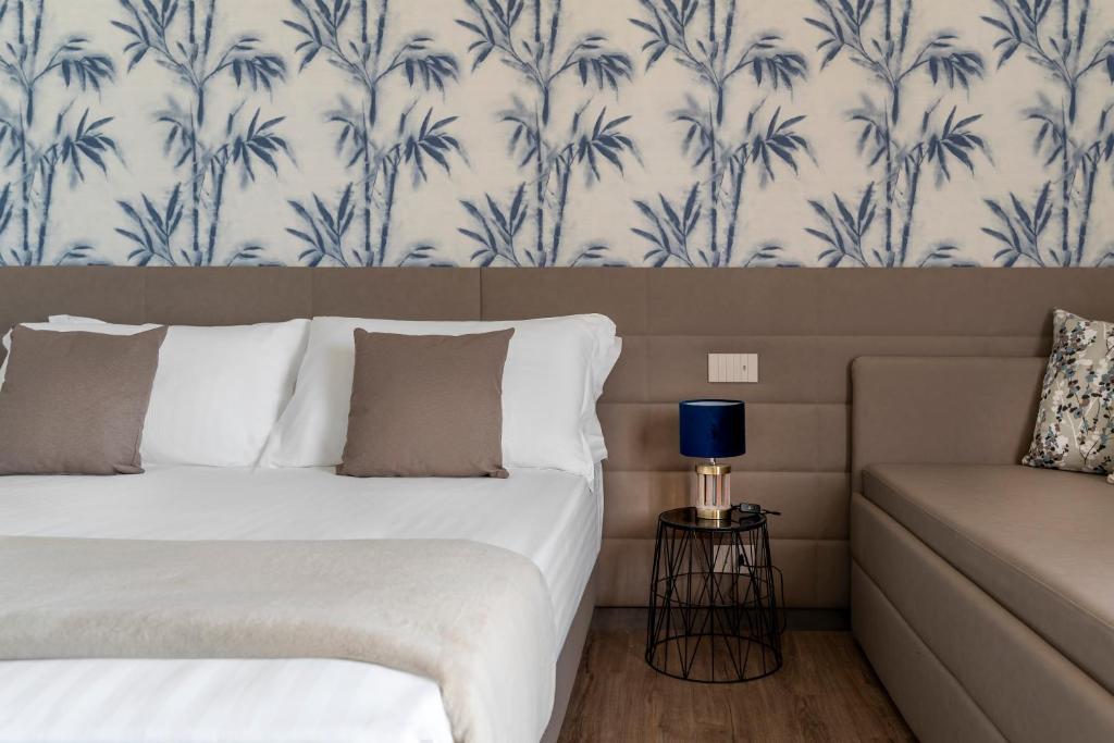 Postel nebo postele na pokoji v ubytování Civico25 Suite Hotel
