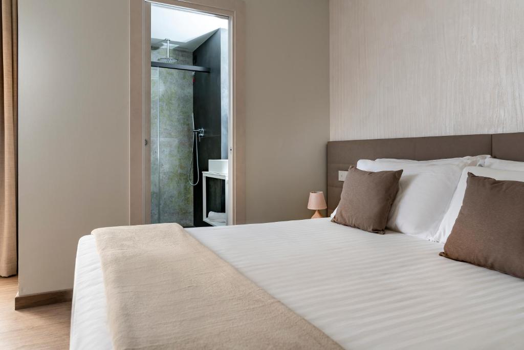 Postel nebo postele na pokoji v ubytování Civico25 Suite Hotel