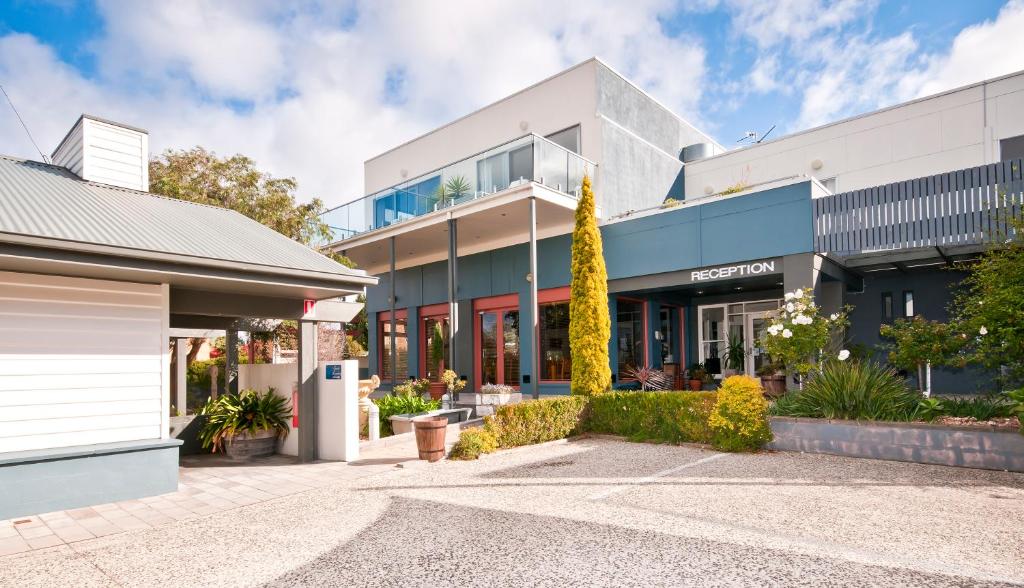 an office building with a driveway in front of it at Captains at the Bay in Apollo Bay