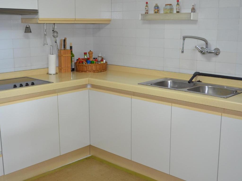 Kuchyň nebo kuchyňský kout v ubytování Apartament singer
