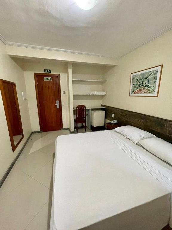 Postel nebo postele na pokoji v ubytování Porto Cálem Praia Hotel