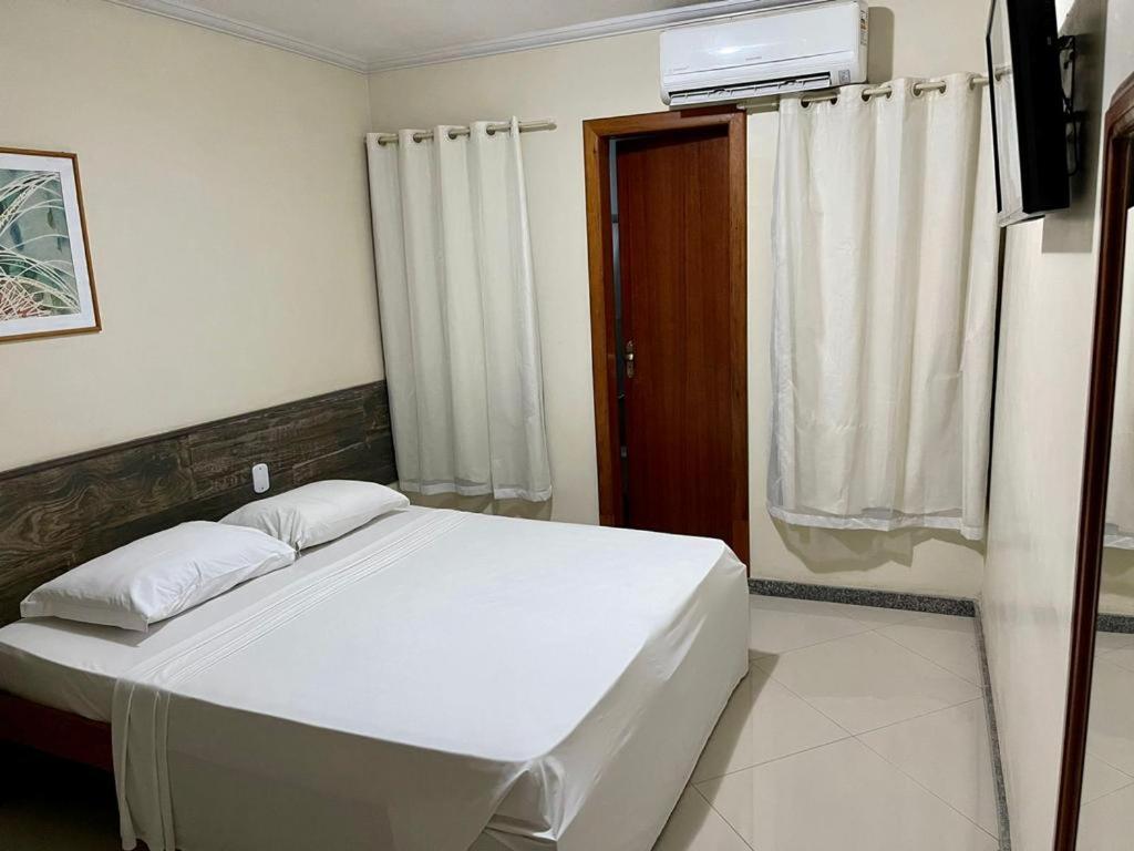 Postel nebo postele na pokoji v ubytování Porto Cálem Praia Hotel