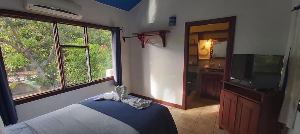 Postel nebo postele na pokoji v ubytování Massai Apartments
