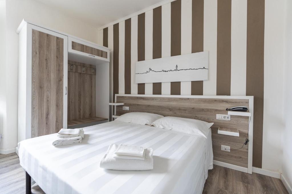 Posteľ alebo postele v izbe v ubytovaní Albergo Centrale