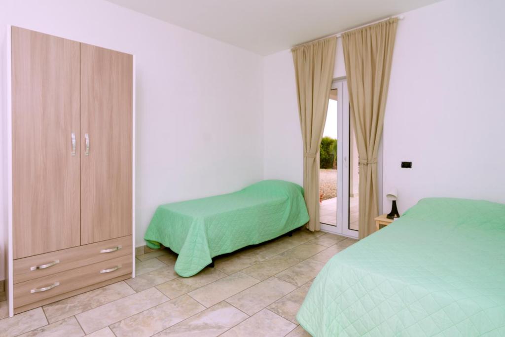 A bed or beds in a room at Brezza dell'Alento