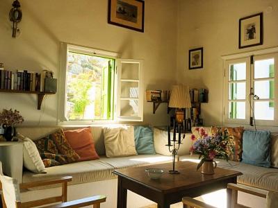 a living room with a couch and a table at Katzilieris Country House in Naxos Chora