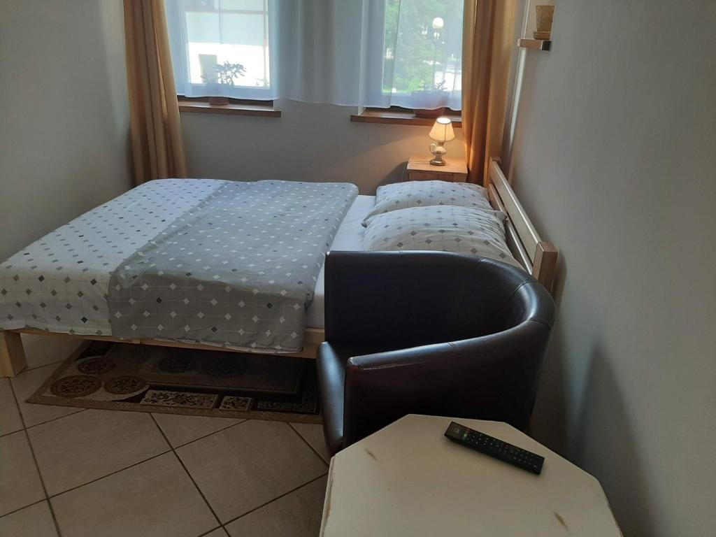 Postel nebo postele na pokoji v ubytování Pension Etiuda