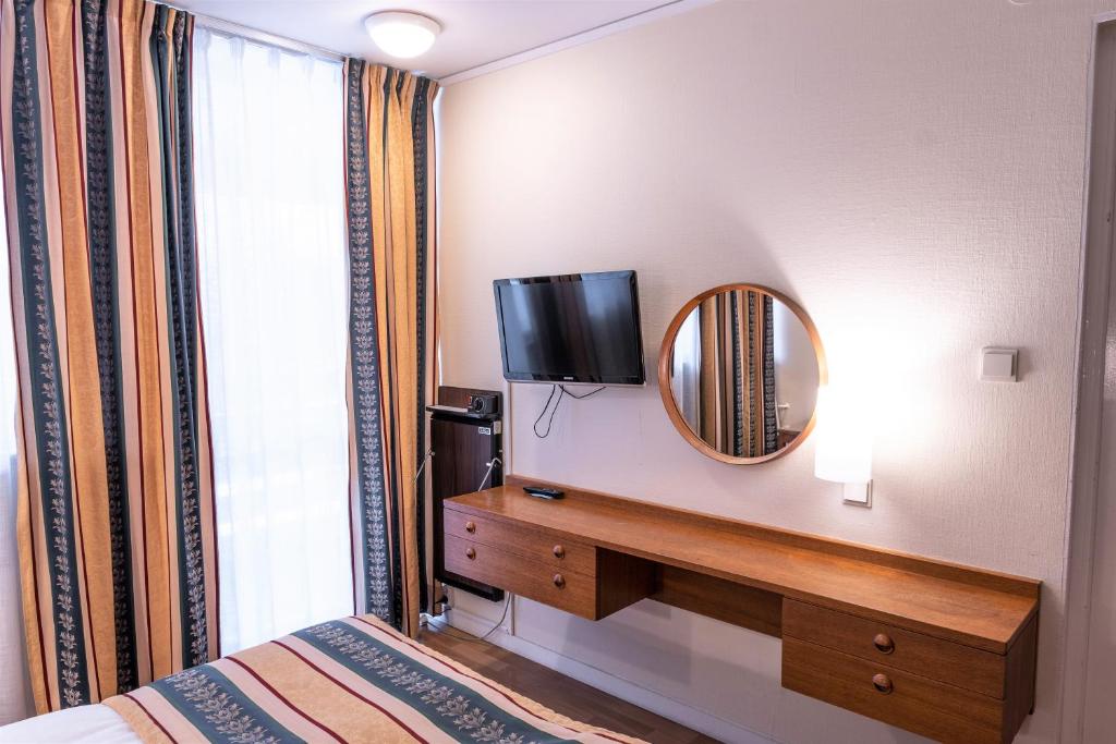 Postel nebo postele na pokoji v ubytování Hotel Fars Hatt