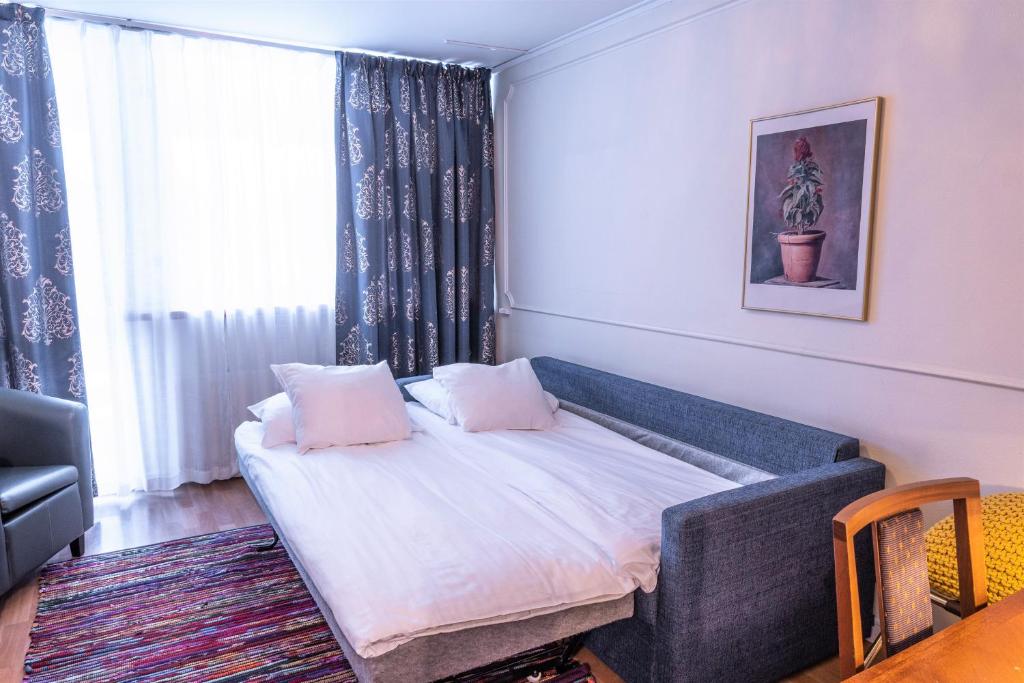 Postel nebo postele na pokoji v ubytování Hotel Fars Hatt