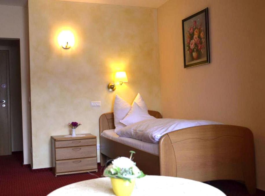 Postel nebo postele na pokoji v ubytování Hotel Die Post Meerfeld