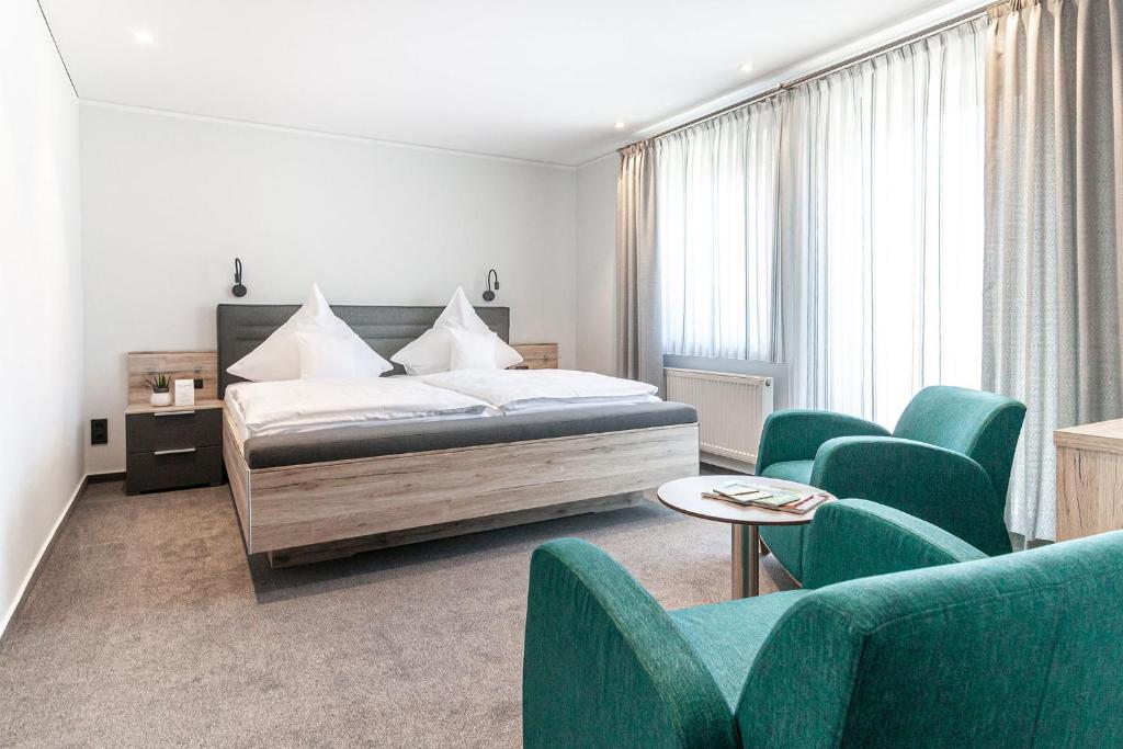 Postel nebo postele na pokoji v ubytování Hotel Die Post Meerfeld