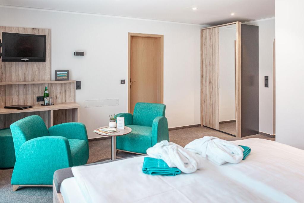 Postel nebo postele na pokoji v ubytování Hotel Die Post Meerfeld