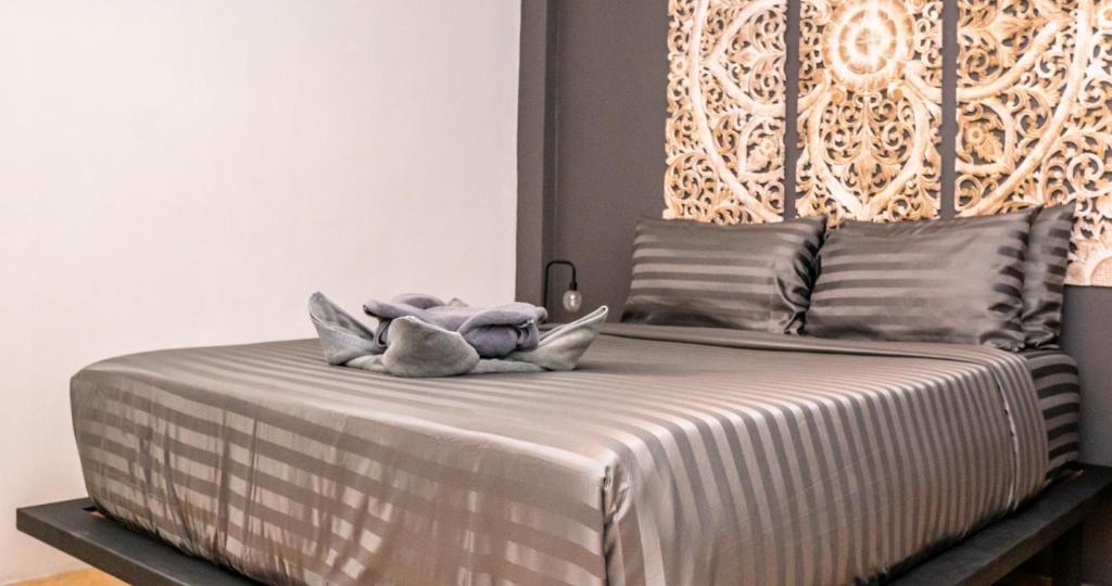 Postel nebo postele na pokoji v ubytování Aqua Suites