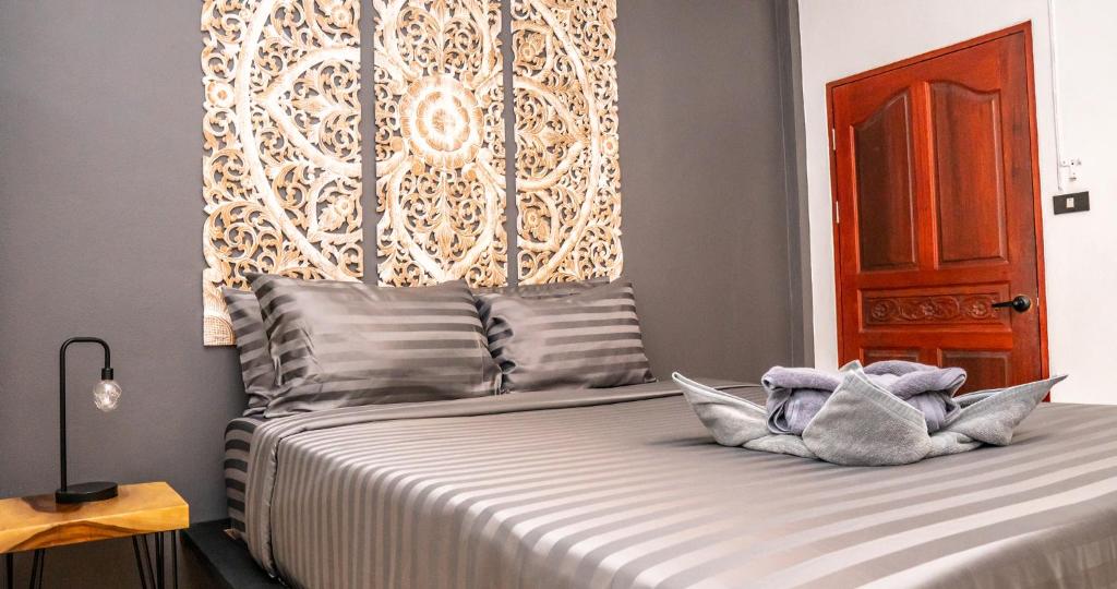 Postel nebo postele na pokoji v ubytování Aqua Suites